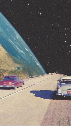 two cars driving down the road in front of a planet