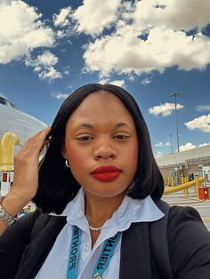 a woman wearing a white shirt and black blazer