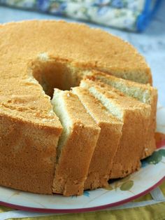 there is a cake that has been cut into pieces and served on a plate with the words vanilla chiffon cake