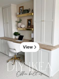 a white desk with a laptop on top of it