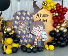 a harry potter birthday party with balloons and decorations