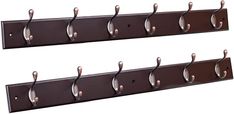 two brown coat racks with hooks on them