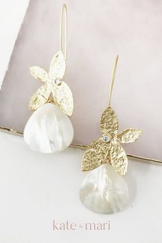 These sweet and delicate earrings feature a matte gold plated butterfly hook and a mother of pearl tear drop. Measures 2.5 inches long and 1 inch wide. Perfect for bridal earrings, rehearsal night earrings or bridesmaids earrings. Elegant bridal jewelry that can be the perfect piece of wedding jewelry for the bride on her special day or the statement jewelry piece for any special occasion. Shop these earrings and other elegant wedding jewelry pieces to add to your special day's jewelry set. Honeymoon Accessories, Summer Wedding Earrings, Summer Wedding Jewelry, Elegant Wedding Jewelry, Handmade Wedding Jewellery, Wedding Accessories For Bride, Bridesmaids Earrings, Wedding Jewelry For Bride, Pearl Earrings Wedding