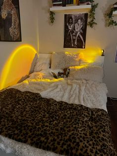 a leopard print blanket on a white bed