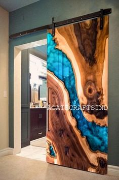 a glass door with an image of a tree trunk and blue water in the background