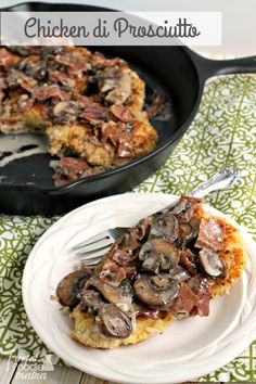 chicken di prosciutto with mushrooms on top in a cast iron skillet