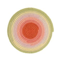 multicolored placemats on white background with circles in the center, top view