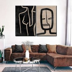 a living room with two paintings on the wall