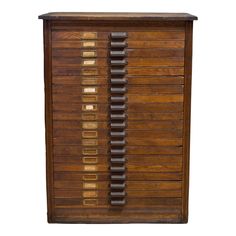 an old wooden filing cabinet with many drawers on the top and bottom, against a white background