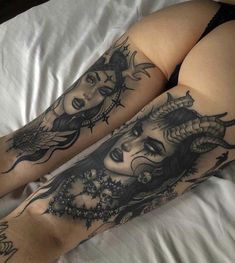 two women's legs with tattoos on them