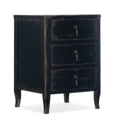 an old black wooden cabinet with three drawers