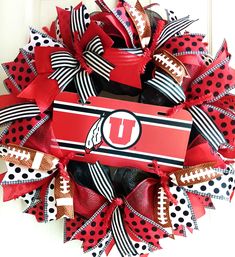 the university of utah football wreath is decorated with polka dots and ribbon