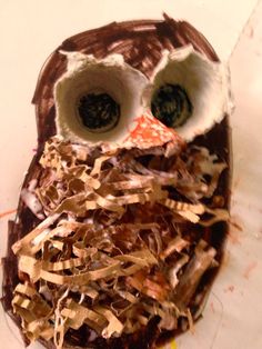 an owl made out of chocolate and shredded paper