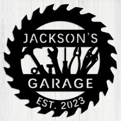 personalized garage sign with tools and wrenches in the center on a wooden background