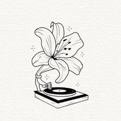 a black and white drawing of a flower on top of a turntable with vinyl