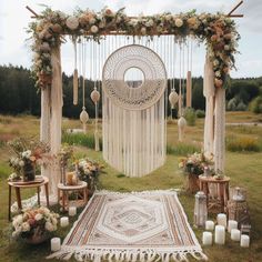 an outdoor wedding setup with flowers and candles