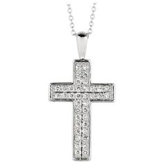 0.35 Carat Natural Diamond Cross Necklace 14K White Gold G SI 18 inches chain 100% Natural Diamonds, Not Enhanced in any way Round Cut Diamond Necklace 0.35CT G-H SI 14K White Gold Pave style 3.00 gram 1 inch in height, 1/2 inch in width 38 stones N5393WD ALL OUR ITEMS ARE AVAILABLE TO BE ORDERED IN 14K WHITE, ROSE OR YELLOW GOLD UPON REQUEST. All Chains of Pendants and Necklaces Can be Requested in 16'' or 18'' Length. . This item is proudly handcrafted in the USA. Perfect gift on any occasion. This Item has passed highest quality inspections. We want you to Wear it, Enjoy it, and Show it off! In case you are not 100% satisfied with this exquisite, elegant and lovely item we have a no hassle 30 day money back return policy. Please message our support team for any questions. Anniversary Necklace With Pave Setting Cross Pendant, Anniversary Cross Pendant Necklace With Pave Setting, Anniversary Cross Necklace With Pave Setting, Classic Brilliant Cut Cross Pendant Necklace, Classic Cross Pendant Necklace With Brilliant Cut, White Gold Cross Pendant Necklace With Pave Setting, Diamond White Cross Pendant Necklace For Formal Events, Anniversary Necklace With Polished Cross Pendant, Formal Cross Pendant Necklace With Pave Setting