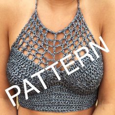 a woman wearing a crochet top with the words pattern on it in front of her chest