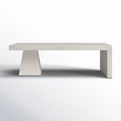 a white bench sitting on top of a white floor