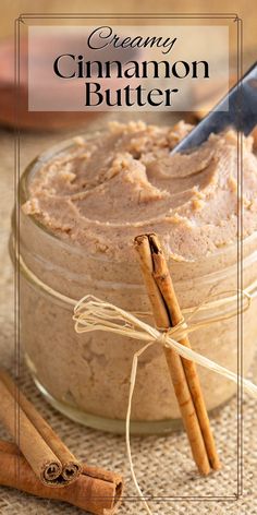 cinnamon butter in a glass jar with cinnamon sticks