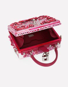 Dolce Box bag in hand-painted resin: Fuchsia Padlock fastening in palladium-electroplated metal with enamel flower embellishment Top handle and adjustable, detachable strap in polished calfskin Calfskin lining and inner pocket with concealed magnetic closure Item comes with special packaging Measurements: H14.5 x W19 x D7 cm Made in Italy The difference in the print placement that you may find on this product is a feature of Dolce & Gabbana’s “Handmade” pieces. A detail that makes every garment or accessory unique and exclusive. Designer Pink Rectangular Case Bag, Luxury Pink Box Bag For Gift, Designer Pink Box Bag With Detachable Handle, Luxury Multicolor Box Bag With Detachable Handle, Designer Red Box Bag For Gift, Luxury Red Box Bag For Gift, Luxury Rectangular Bags For Fashion Events, Designer Pink Box Bag For Evening, Designer Pink Evening Box Bag