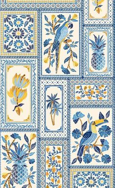 a blue and yellow tile with flowers, birds and pineapples on the side