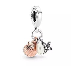 "This triple charm features a trio of ocean treasures. Hanging from the bail are a sterling silver starfish a freshwater pearl and a rose gold-plated seashell with realistic grooved detailing. The side of the bail has the message \"You are my treasure.\" The perfect gift for the beach lover in your life. Compatible with Pandora. Gift: Please select gift at checkout. All charms come with a self assemble pillow box, tissue paper & ribbon. Gift wrap is supplied for as little as £1 💝" Triple Charm, Pandora Bracelet Charms Ideas, Pandora Original, Micro Beads, Stella Marina, Ocean Treasures, Charms Pandora, Bracelet Pandora, Bracelet Charms