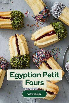 egyptian petit fours with sprinkles and confetti on the side, surrounded by other pastries