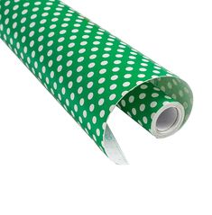 a roll of green and white polka dot paper