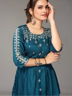 HAND CRAFTED TUNIC DESCRIPTION * Teal regular cinched waist top * Flora Embroidered * Round neck, three-quarter, regular sleeves * Embroidered detail * Woven *Fabric:- Rayon *Package Contains:- Only one kurti *Wash Care:- Hand Wash AVAILABLE IN 7 SIZES THEY ARE IN FOLLOWING MEASUREMENTS IN INCHES:- XXS:- Bust-32/Waist-24/Length-30 XS:- Bust-34/Waist-26/Length-30 S:- Bust-36/Waist-28/Length-30 M:- Bust-38/Waist-30/Length-30 L:- Bust-40/Waist-32/Length-30 XL:- Bust-42/Waist-34/Length-30 XXL:- Bust Indo Western Kurtis, Indowestern Kurti, Kurti Short, Western Kurti, Western Kurtis, Kurti Top, A Line Kurti, Indian Tunic, Kurtas For Women