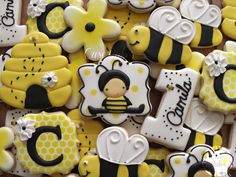 decorated cookies are arranged in the shape of bees