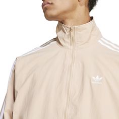 The adidas Firebird Men's Woven Track Jacket is launching that iconic style of a black track jacket from the 70s, 80s, and 90s into a look for today. This track jacket's laid-back style is ideal if you're always on the go. It's fashionable enough for everyday wear and comfortable enough to stay warm all day.Features: Front pockets. Iconic adidas logo and three-stripe design. Has collared neck. Details: Full-zip. Ribbed cuffs and hem. Material: 100% Polyester Tricot. Adidas Three Stripes Track Jacket For Spring, Adidas Spring Windbreaker With Three Stripes, Adidas Track Jacket For Spring, Adidas Track Jacket For Spring Sportswear, Adidas Sportswear Track Jacket For Spring, Spring Urban Track Jacket With Three Stripes, Urban Style Track Jacket With Three Stripes For Spring, Spring Urban Style Track Jacket With Three Stripes, Adidas Spring Outerwear With Three Stripes Branding