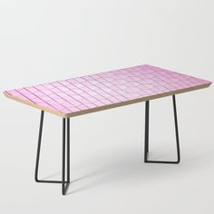 a table that is made out of metal and wood with a blue checkered design on the top