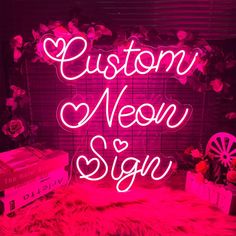 a neon sign that says, custom neon sign on a fur rug in front of a pink background