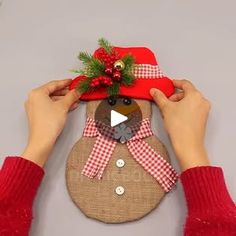 someone is making a snowman ornament out of burlap