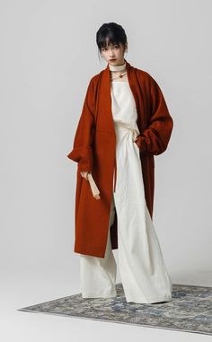 As the days grow shorter and colder, there's one thing we always look forward to this time of year: modernized hanfu coats! The Hou Xue 厚雪 Heavy Snow Trench Coat combines the voluptuous collar styles of the Han Dynasty with a modern trench coat silhouette. Effortlessly chic, and out of this world stylish, make a statement wherever you go with this beauty of a coat. Additionally has pockets to keep your hands warm! When buttoned, the distinct waist lines are a reference to Han Dynasty robes. Inst Oversized Long Sleeve Winter Robe, Fall Outerwear With Kimono Sleeves For Daywear, Modernized Hanfu, Modern Trench Coat, The Han Dynasty, Modern Hanfu, History Taking, Heavy Snow, Fan Jewelry