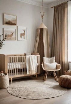 a baby's room with a crib, rocking chair and pictures on the wall