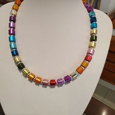 "One line strand necklace, handmade, lined with silver beads and colored aluminum beads like the colors of the rainbow, a chain that makes a statement and at the same time a minimalist necklace; due to its particular color, it is impressive with any outfit, and for any occasion, the necklace is easy to wear, with the addition of an extension of a sterling silver chain of two sizes Customizable. The rainbow necklace will decorate your neck and add grace and beauty to your appearance, and complime Rainbow Bar, Colorful Statement Necklace, Multicolor Necklace, Multicolor Jewelry, Necklace Colorful, Rainbow Necklace, Necklace Chunky, Modern Necklaces, Wedding Jewellery Necklace