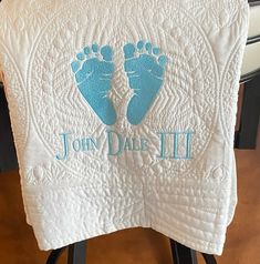 a white towel with blue imprints on it and the words, john dale ii