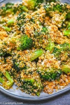 cooked broccoli florets with parmesan cheese and seasoning on top