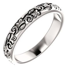 a white gold wedding ring with filigrees