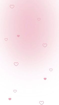 a pink background with hearts flying in the air