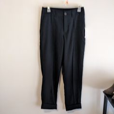 Nice Black Pants That Have Pockets In The Front, Zipper And Two Buttons. Waistband Has Elastic Just In The Back, Belt Loops, Fake Back Pockets. Seam Runs Down The Middle Of Each Leg In The Front, Wide Cuff That Is Tacked On Each Side. Inseam Is 27", Rise 11", Across The Waist Is 14", Size 6. Rayon And Polyester, No Stretch, And New With Tags. Workwear Stretch Pants With Cuffed Ankles, Workwear Pants With Elastic Waistband And Cuffed Ankles, Stretch Pants With Cuffed Ankles For Work, Stretch Workwear Pants With Cuffed Ankles, Black Non-stretch Pants With Elastic Waistband, Black Bottoms With Side Pockets And 4-way Stretch, Black Ankle-length Pants With Button Closure, Denim Jumpsuit Overalls, Black Pants With 5-inch Inseam And Elastic Waistband