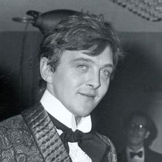 black and white photograph of a man in a tuxedo