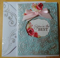 an ornate card with a bow on the front and side, which says you're the best