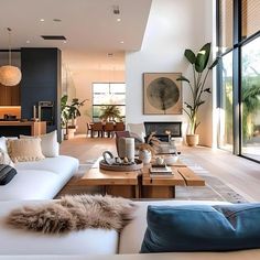 a living room filled with furniture and lots of windows