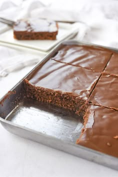 a pan filled with chocolate cake sitting on top of a table