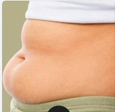 a woman's stomach with an apple on the bottom and black dot in the middle