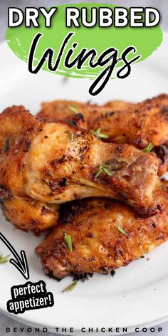 chicken wings on a white plate with the words dry rubbed wings above it and an image of