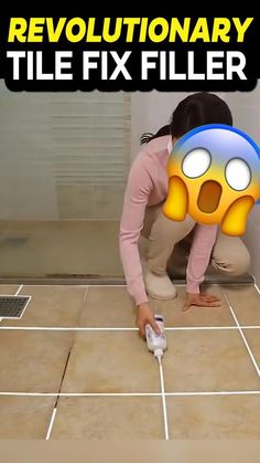 a woman kneeling down on the floor in front of a tile floor with an emoticive face